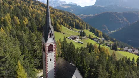 Beautiful-Aerial-View-of-Saint-Jakob's-Church-in-Val-Gardena,-Dolomites