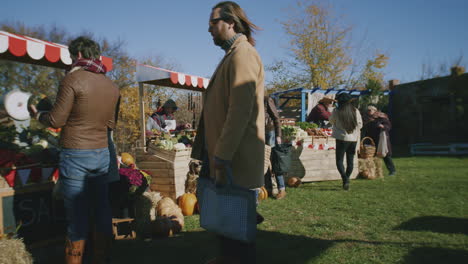 people shopping on urban farmers market people shopping on urban farmers market choose fresh products cares about health and spending day off by buys proper nutrition autumn fair outdoors agriculture