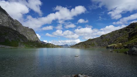 time lapse of clouds passing over a mountainous lake in alaska