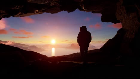 hombre en una cueva al amanecer