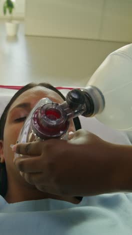 patient receiving respiratory assistance in a hospital setting.