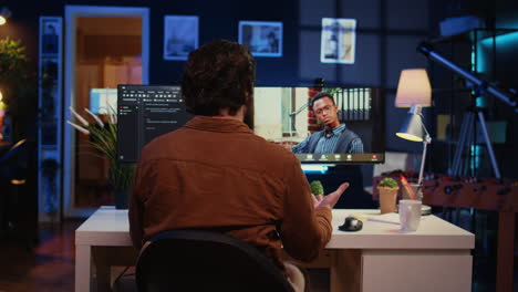 remotely working software developer talking with manager during online videocall