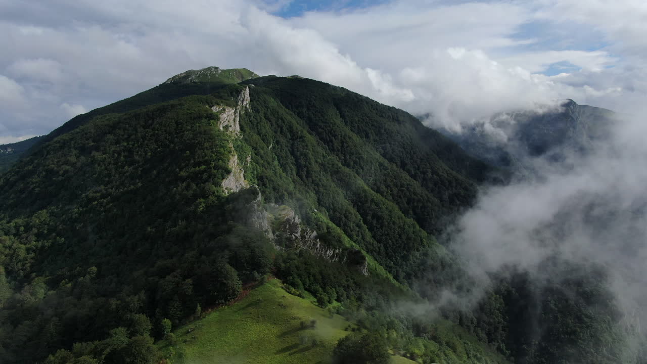 Breathtaking view of a lush mountain shrouded in mist Nature's beauty on full display