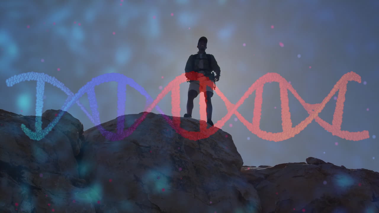 Silhouette of person on rock with DNA strand animation overlay