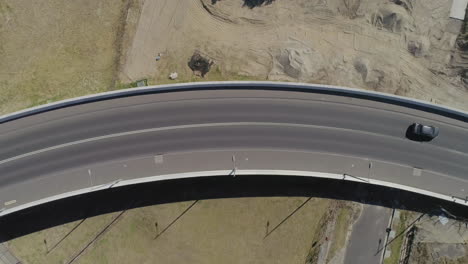 Cars-crossing-new-bridge-bypass-on-bright-summers-day-from-static-aerial-perspective
