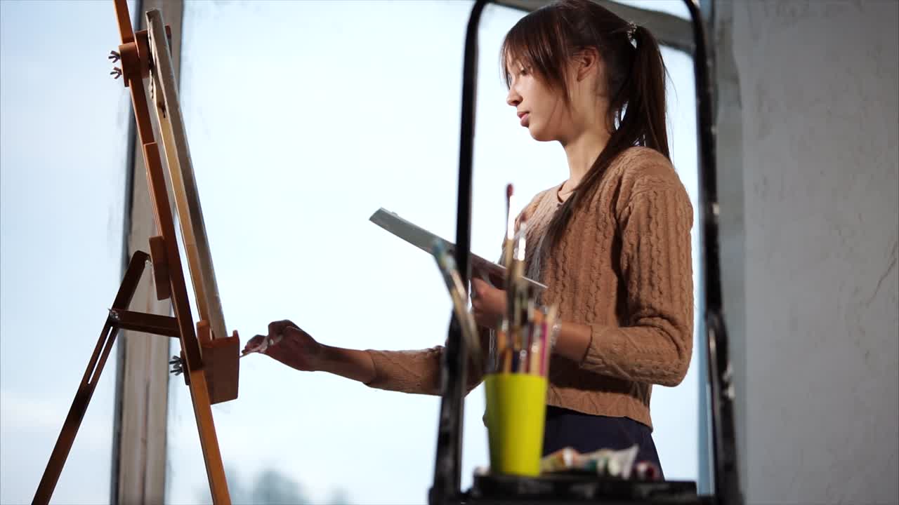 Young Woman Painting at an Easel