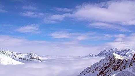 winter time lapse moving clouds above white mountain