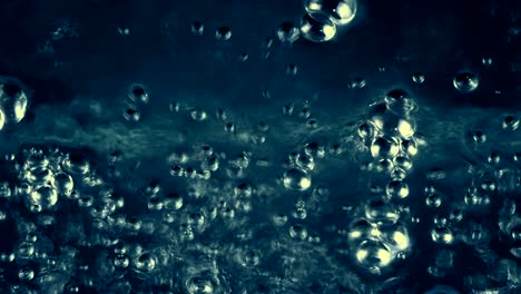 burbujas de agua detrás del fondo de vidrio