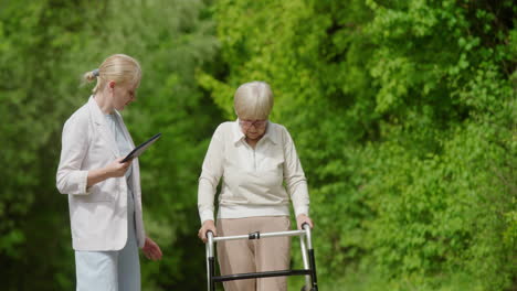 elderly woman with a walker being assisted by a care giver