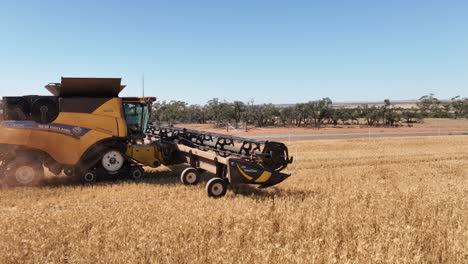 This-footage-captures-the-synergy-of-modern-agricultural-technology,-showcasing-the-essential-role-of-header-fronts-in-the-wheat-harvesting-process