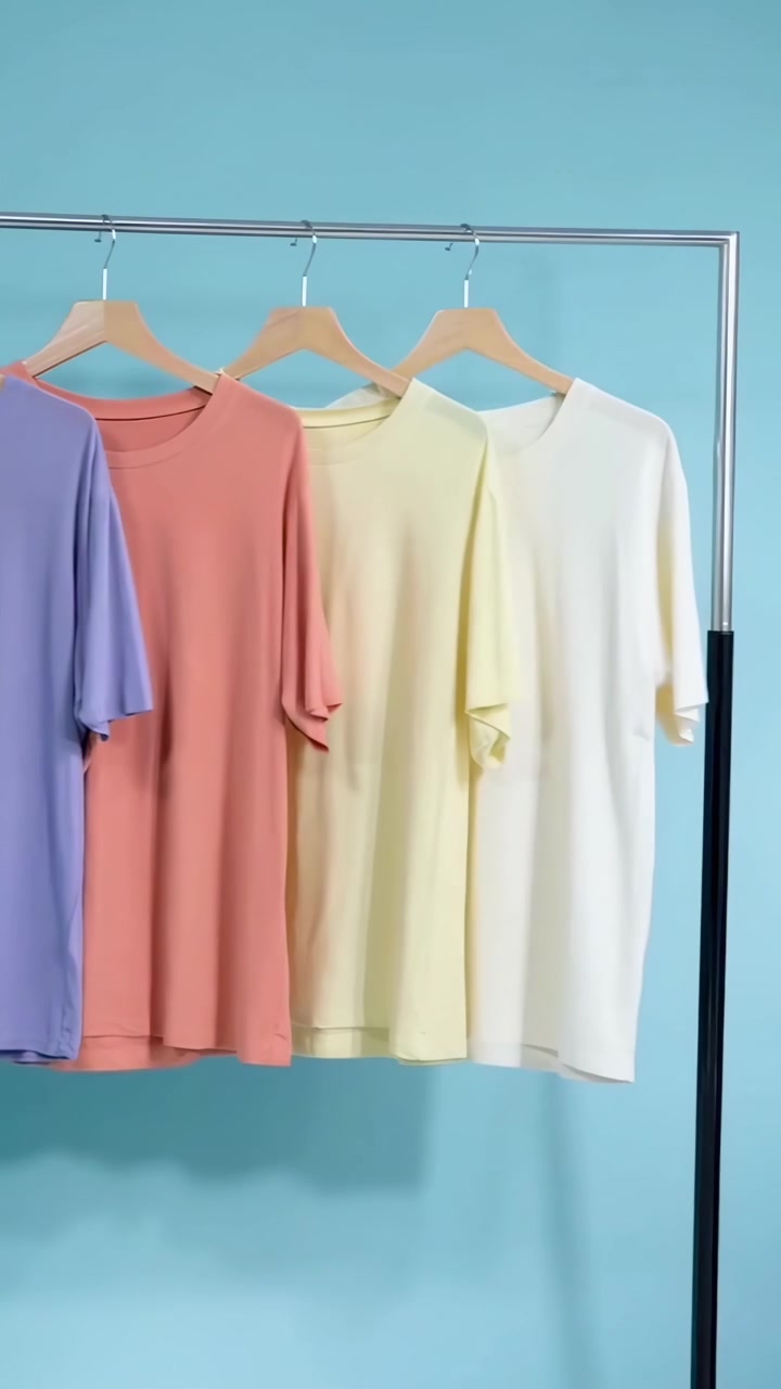 Colorful T-shirts Hanging on a Clothing Rack