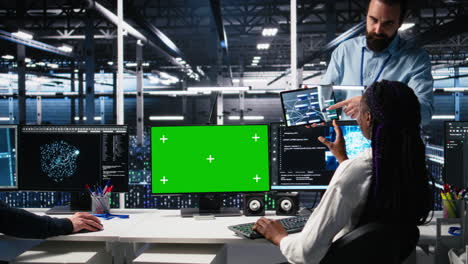 female programmer talking with manager in ai data center, using mockup pc
