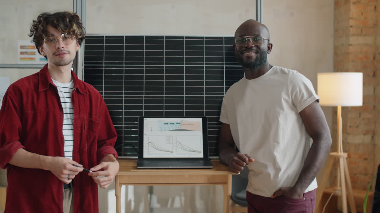 Portrait of Multiethnic Male Colleagues by Solar Panel in Office