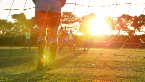 Female-soccer-player-stopping-the-ball-in-goal-4k