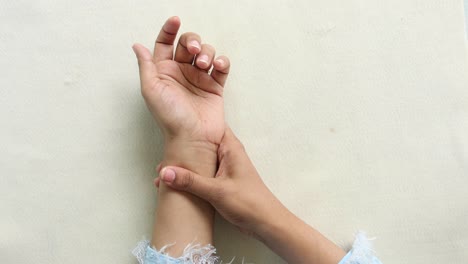 young women hands suffering wrist pain,