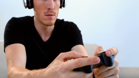 man playing video game in living room 4k