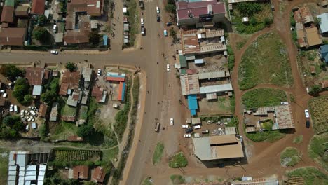 aerial view above people and cars on the streets of the oloitokitok town, in kenya - overhead, drone shot