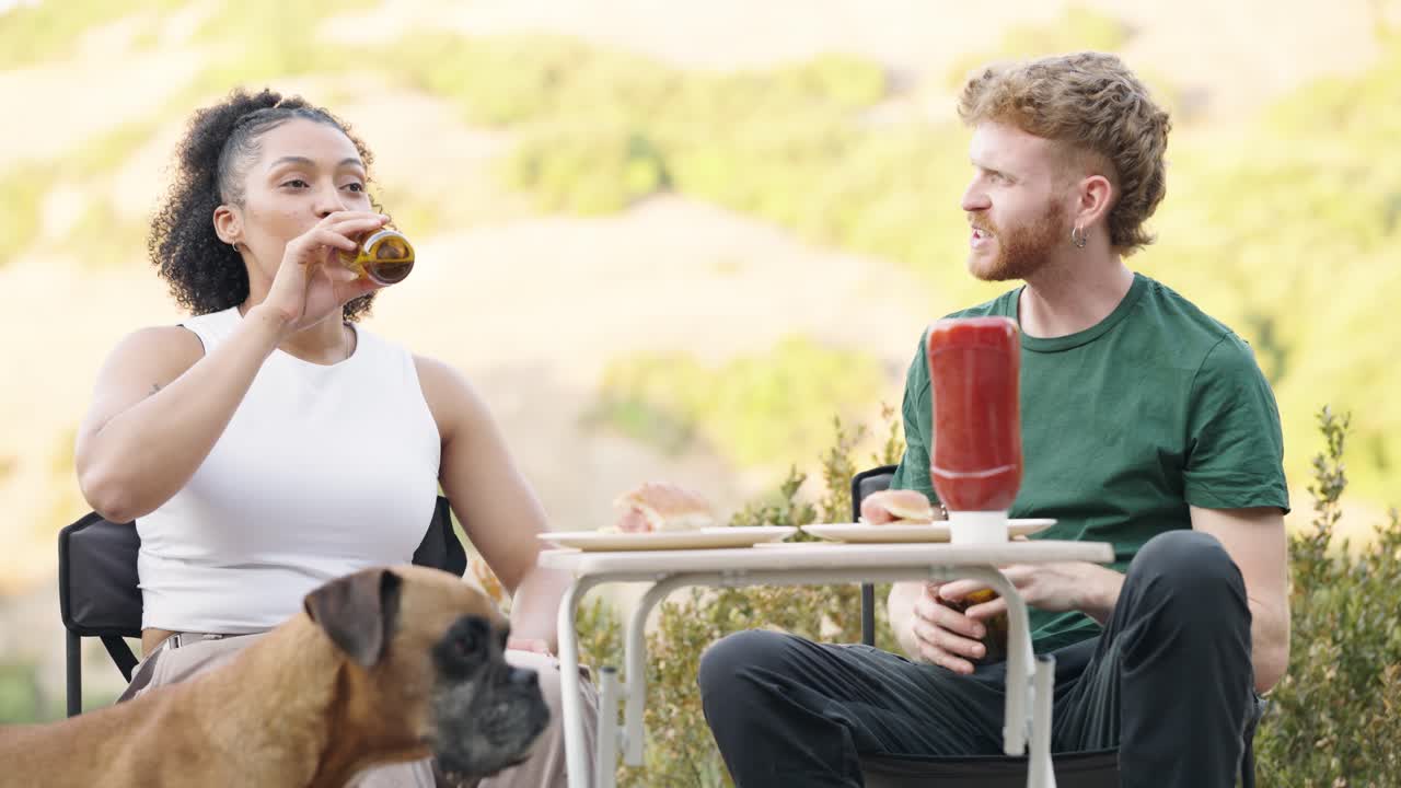 People enjoying a picnic with their dog