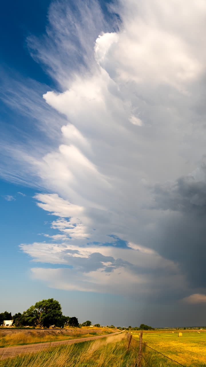 Evening storm clouds glowing with soft sunset colors and texture
