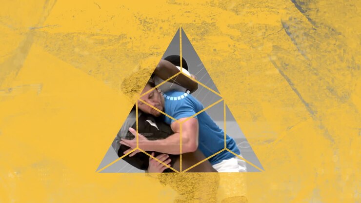 Animation with geometric shapes overlaying people embracing in dynamic school scene