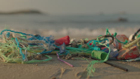 beach in greece covered in rubbish