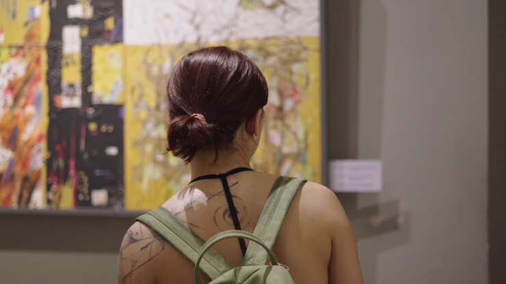 Woman viewing art in a museum