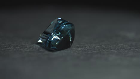 polished blue gemstone rotates and sparkles