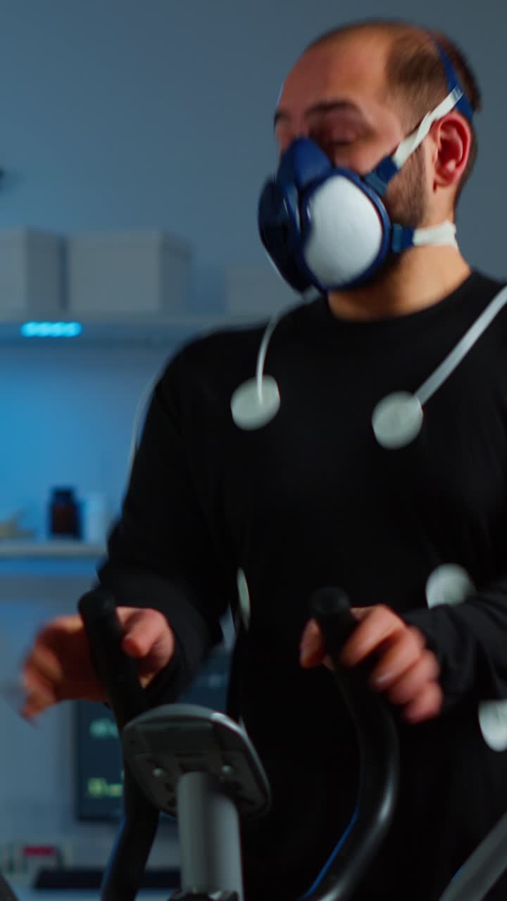 Athlete Undergoing Performance Test with Oxygen Mask and Sensors