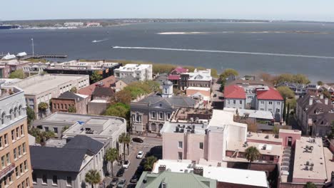 aerial descending and panning shot of the historic old exchange and provost dungeon building in the french quarter of charleston, south carolina