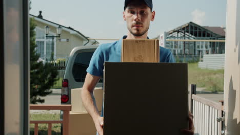 delivery person with packages at home