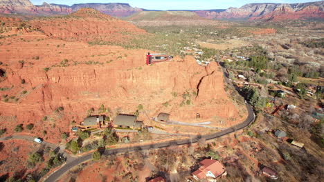 drone shot of modern futuristic house in sedona arizona, red rock point building and landscape