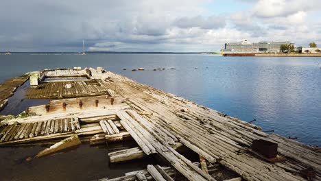 beautiful motion panning of broken pier and the port of tallinn city in the distance