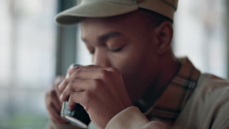 black man, cafe and coffee with laptop