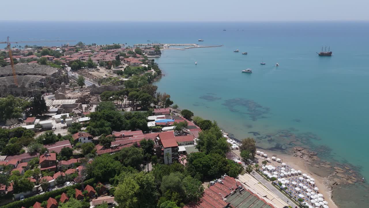 Aerial View Ruins of the Ancient City of Side in Antalya Province on the Mediterranean Coast. Old Statues in the State Agora. The Fragments of Ancient City Wall Bas Relief, Columns Antique Theater 4K