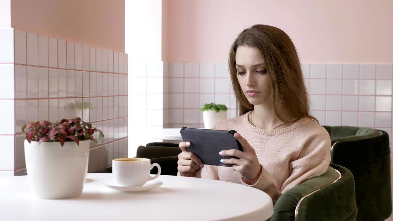 Elegant beautiful caucasian woman using tablet, texting, typing. Smiling, looking away 60 fps