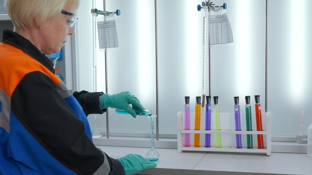 Scientist Performing a Chemical Experiment in a Laboratory