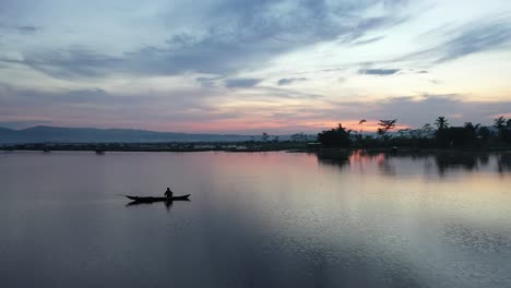 fishermen looking for fish at sunset at rawa