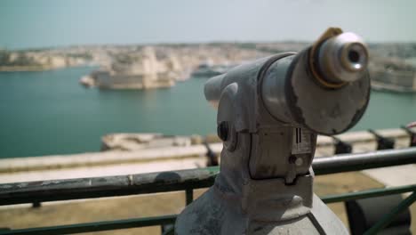 Vista-point-telescope---binoculars-overlooking-the-Three-Cities-in-Malta