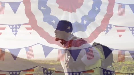 animation of american flag over african american man hiking in mountains