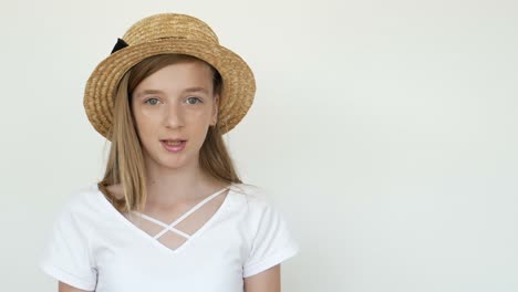 portrait of a girl wearing a straw hat