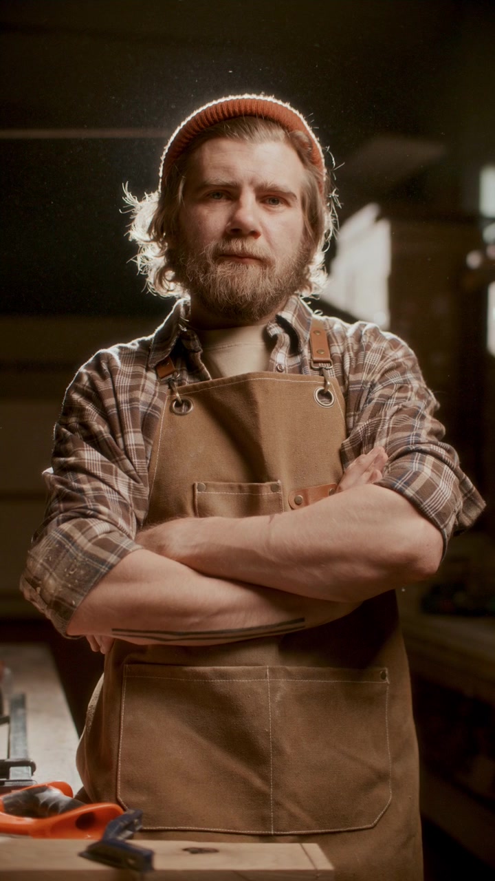 Portrait of Confident Carpenter Standing with Arms Crossed in Workshop