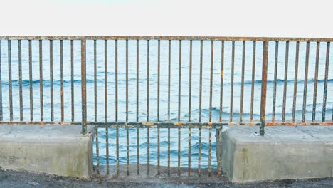 Rusty-iron-handrail-on-coastline-of-Tenerife,-static-view