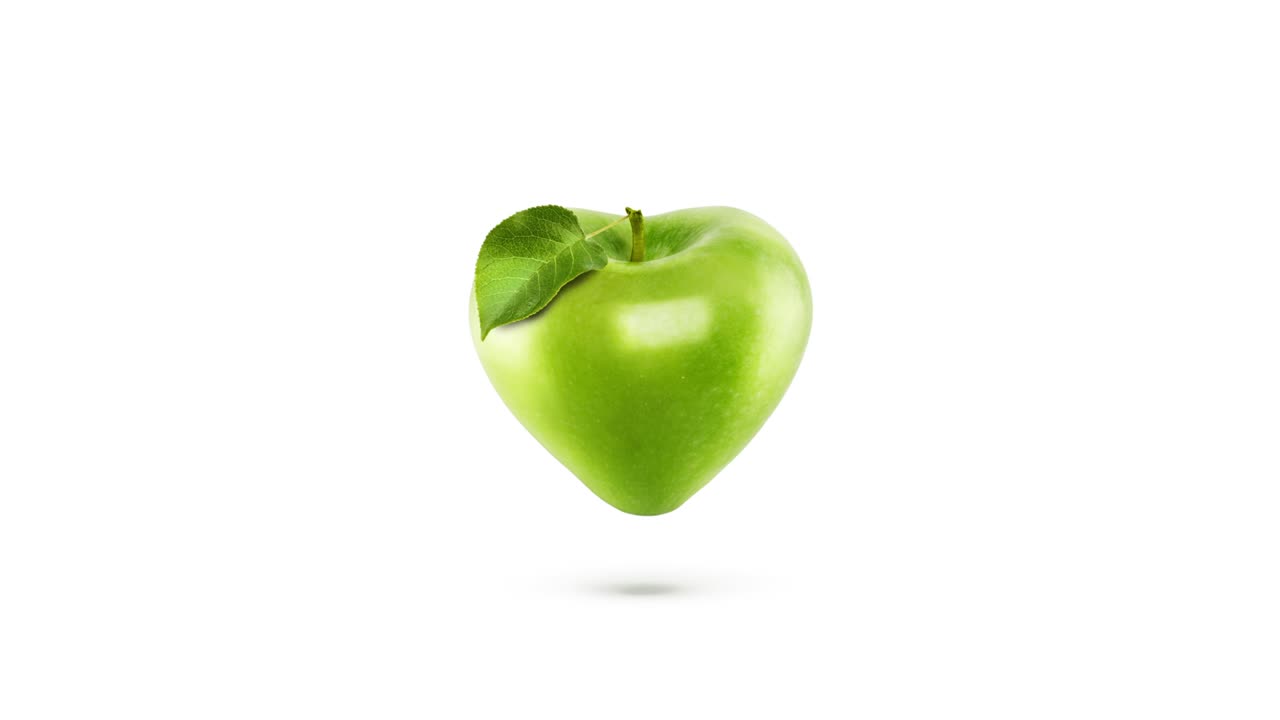 manzana de color verde en forma de corazón con animación de latidos de corazón sobre un fondo blanco.