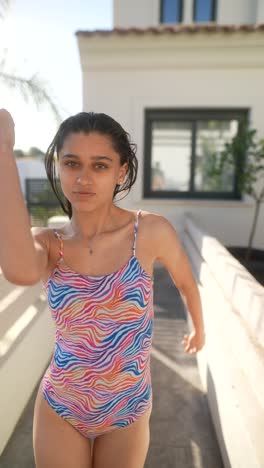 woman in a colorful swimsuit outdoors