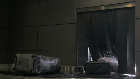 travel bags and suitcases on the luggage carousel