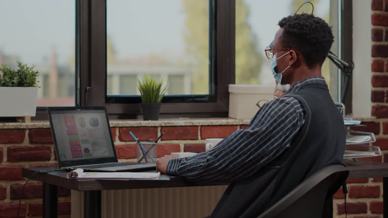 Male secretary using landline phone to discuss career development