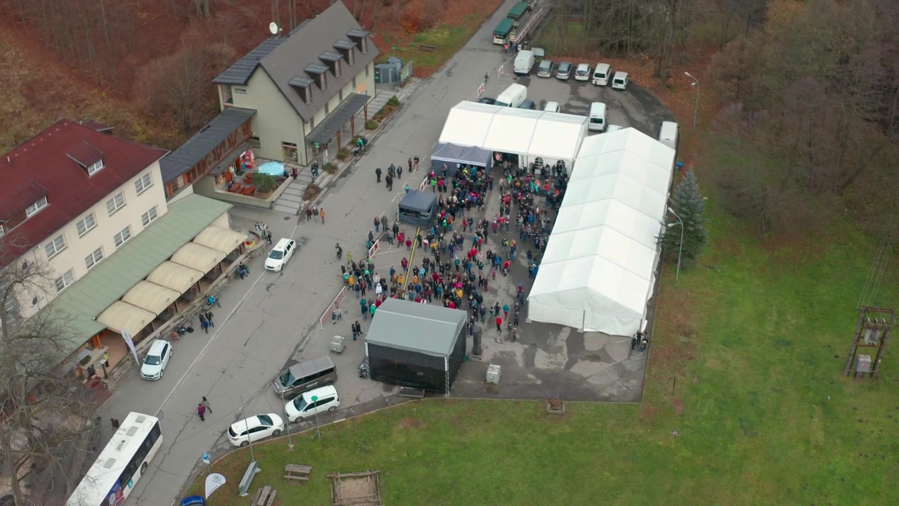 drone flying over small town skalnimlya near blasnko in czech republi cover some people n a concert going towards natural reserve moravain karst