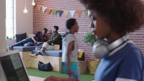 young african american business woman checking smartwatch working on creative project in trendy office workplace