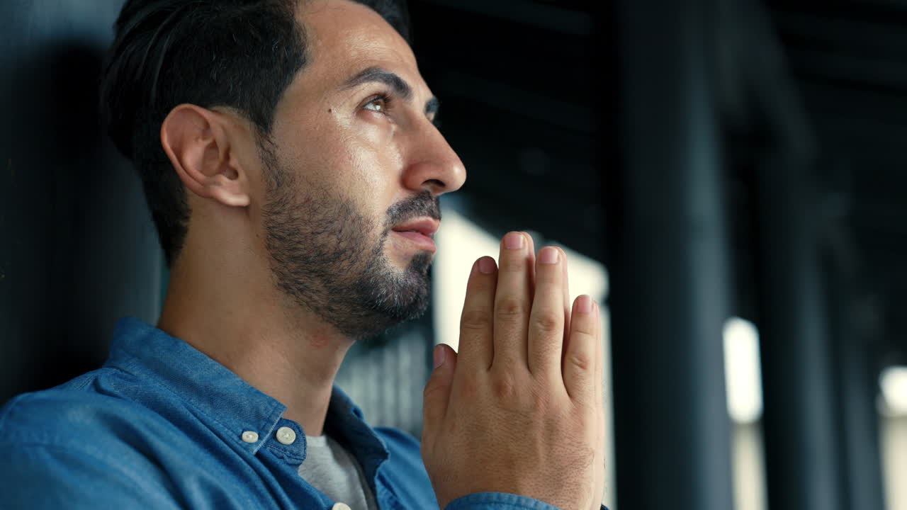 Man Praying with Eyes Closed and Open, Looking Up in Hope