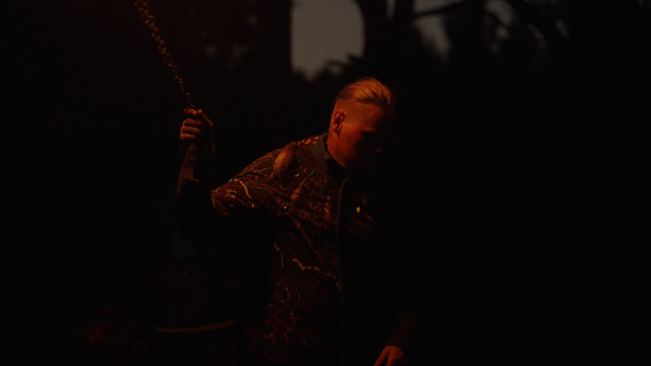 Person at a Night Campfire